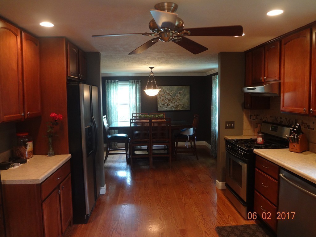 81 Calley Street Springfield, MA 01129 - Photo 10 of 26 a kitchen with kitchen island granite countertop stainless steel appliances lots of counter top space and furniture