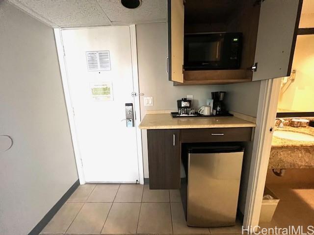 1850 Ala Moana Boulevard, Unit 915 Honolulu, HI 96815 - Photo 7 of 24 a utility room with a sink a washer and dryer
