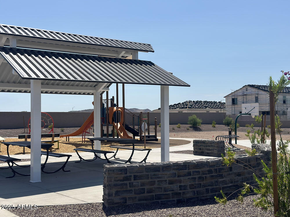 7586 West Av. Del Rey Peoria, AZ 85383 - Photo 15 of 18 a view of a patio with chairs and table
