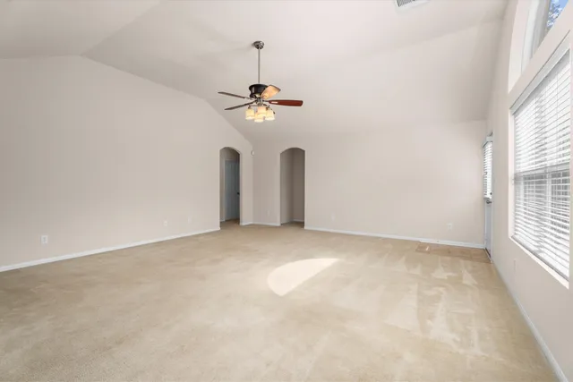 a view of an empty room with a window