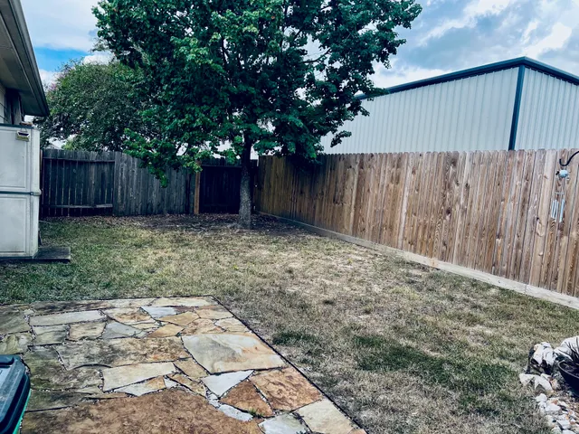 a view of a house with a potted plant