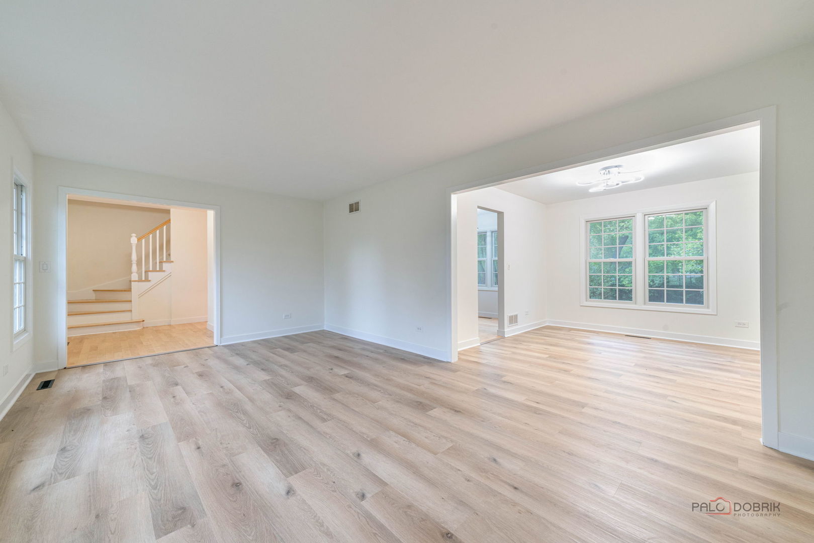 1338 Trinity Place Libertyville, IL 60048 - Photo 11 of 24 a view of an empty room with wooden floor and a window