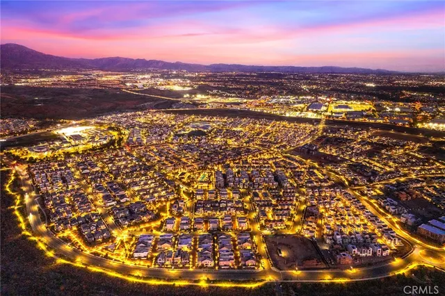 a view of a swimming pool with a table and chairs in the ocean