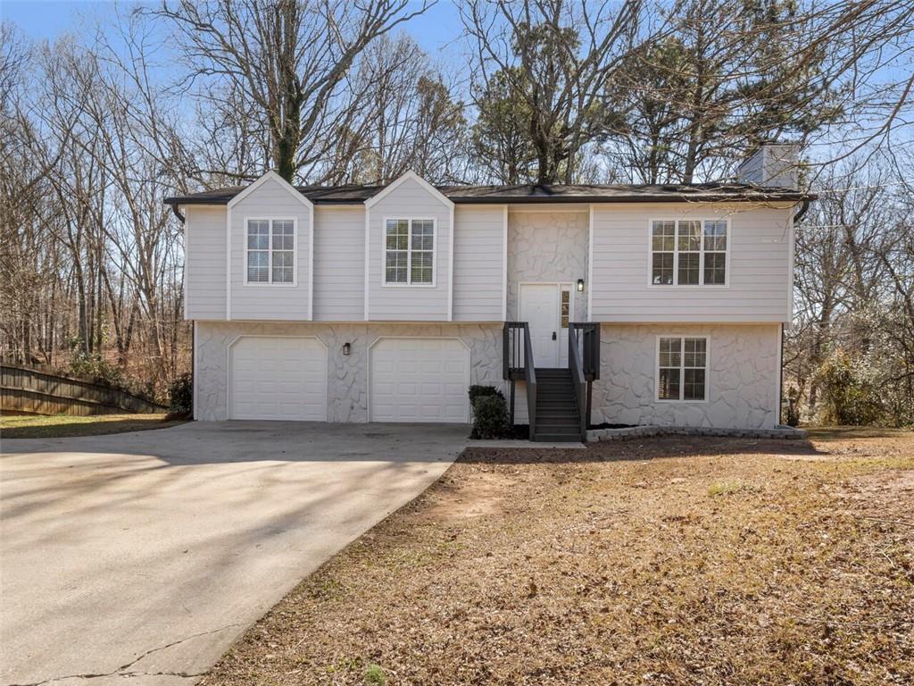 3660 Anneewakee Road Douglasville, GA 30135 - Photo 1 of 1 a view of a house with a yard covered in snow