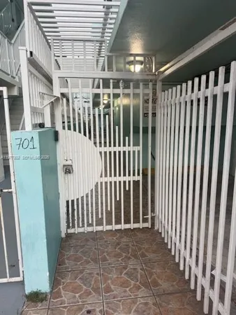 a view of a porch with wooden floor