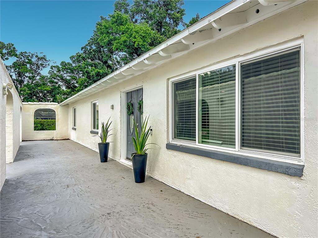 153 Variety Tree Circle Altamonte Springs, FL 32714 - Photo 3 of 44 a view of potted plants in front of a house