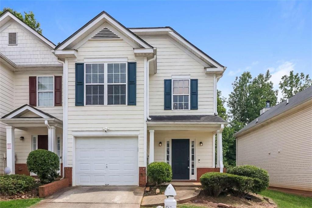 3712 Harvest Drive Decatur, GA 30034 - Photo 1 of 1 a view of a white house with a large windows and potted plants