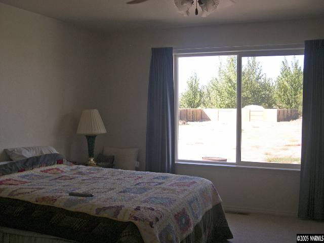 4190 Alcorn Road Fallon, NV 89406 - Photo 4 of 4 a bedroom with a bed and a window