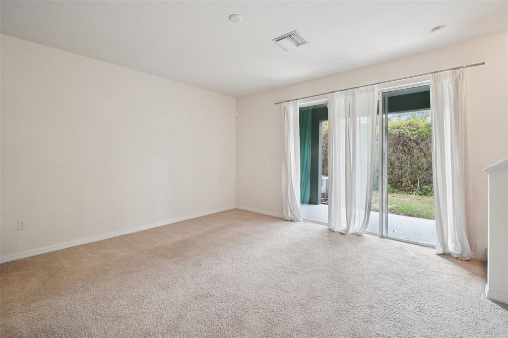 8986 Indigo Trail Loop Riverview, FL 33578 - Photo 13 of 48 a view of an empty room with a window