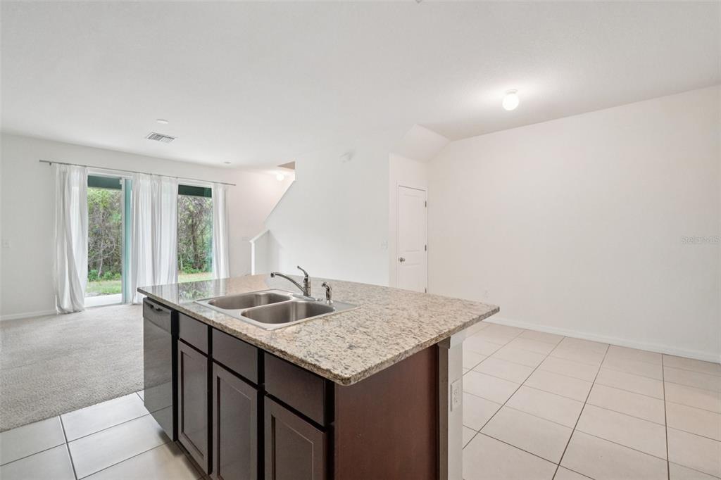 8986 Indigo Trail Loop Riverview, FL 33578 - Photo 16 of 48 a bathroom with a granite countertop sink and a mirror