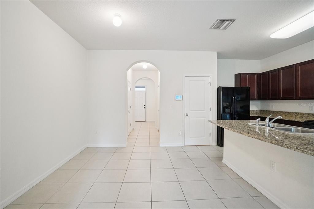 8986 Indigo Trail Loop Riverview, FL 33578 - Photo 17 of 48 a large kitchen with a stove a sink dishwasher and a refrigerator