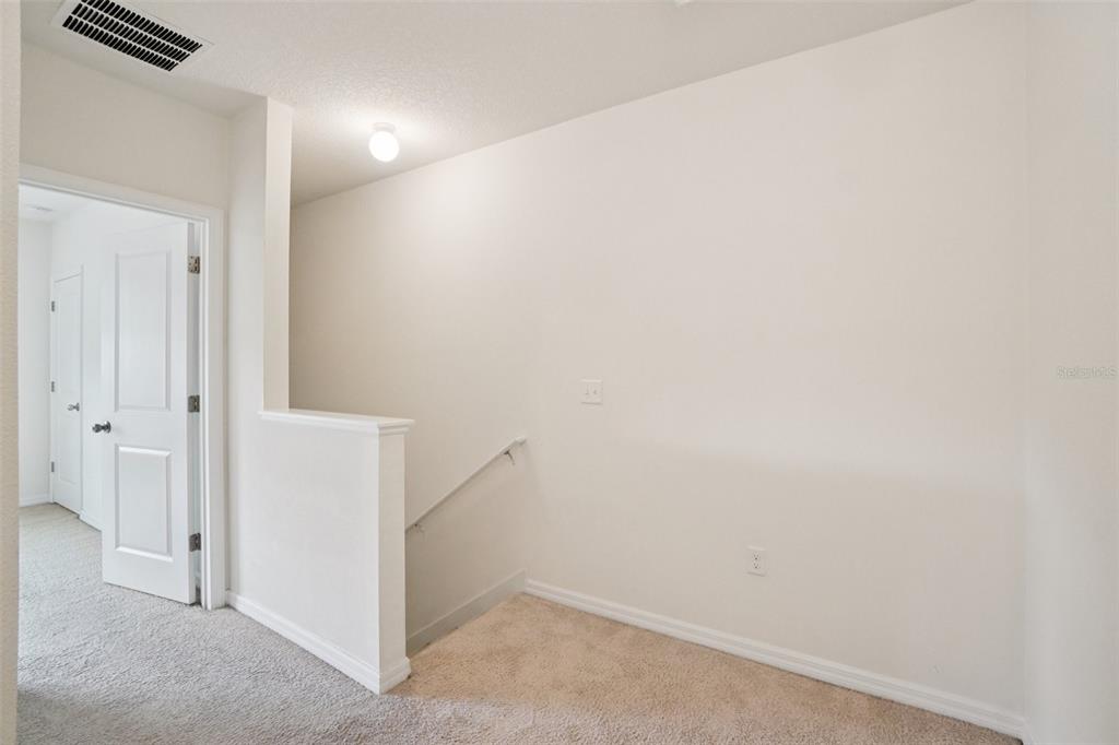 8986 Indigo Trail Loop Riverview, FL 33578 - Photo 23 of 48 an empty room with an entryway