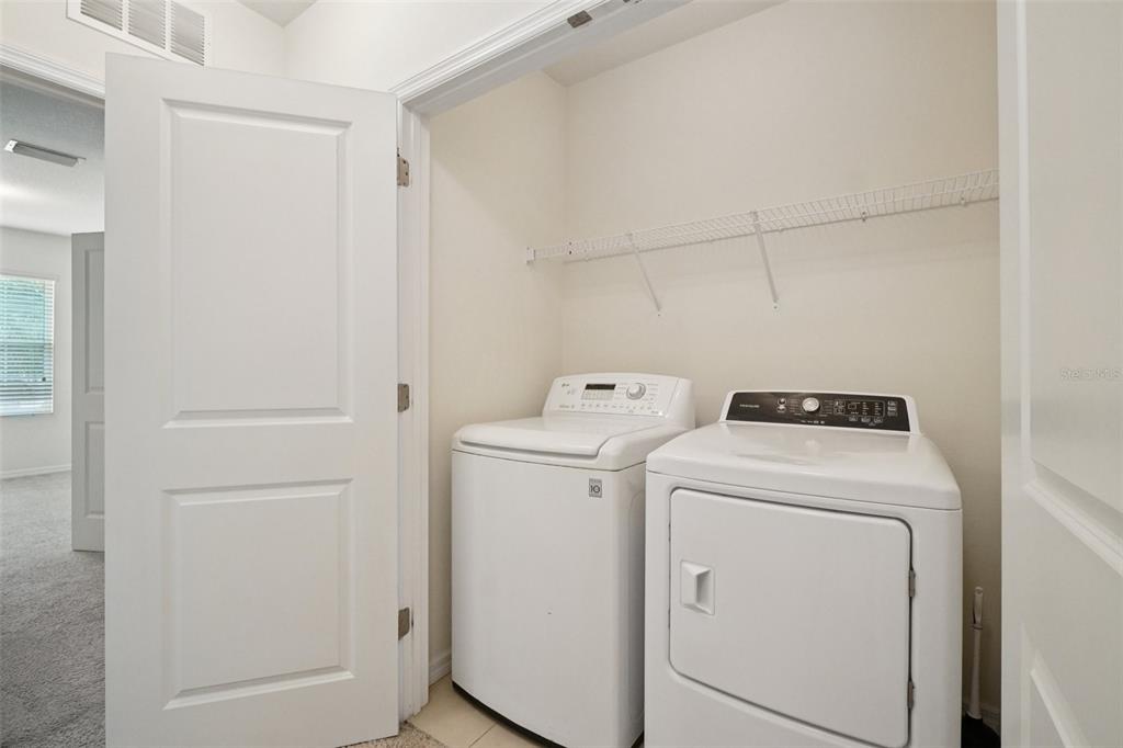 8986 Indigo Trail Loop Riverview, FL 33578 - Photo 24 of 48 a utility room with dryer and washer