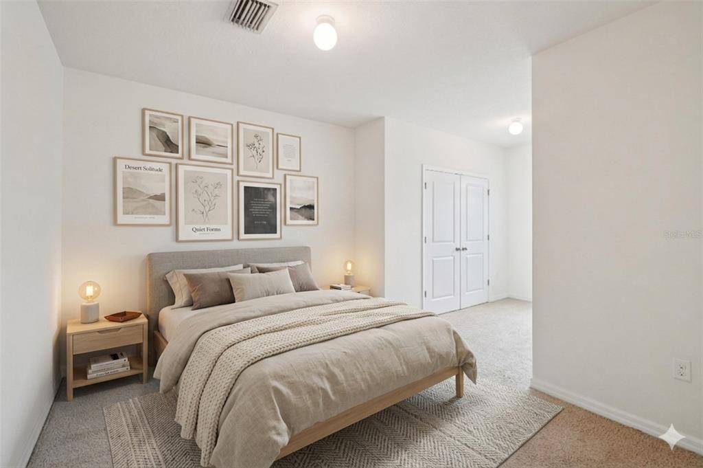 8986 Indigo Trail Loop Riverview, FL 33578 - Photo 26 of 48 a bedroom with a bed and painting on the wall