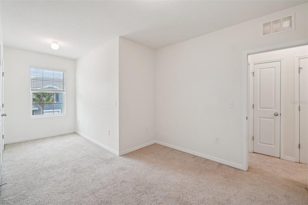 8986 Indigo Trail Loop Riverview, FL 33578 - Photo 28 of 48 an empty room with windows