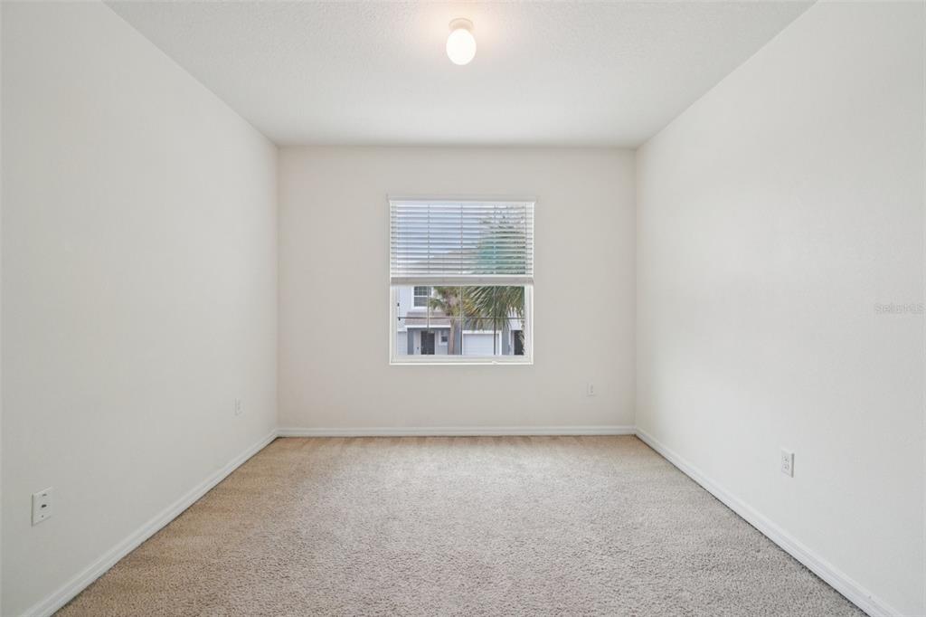 8986 Indigo Trail Loop Riverview, FL 33578 - Photo 32 of 48 an empty room with a window