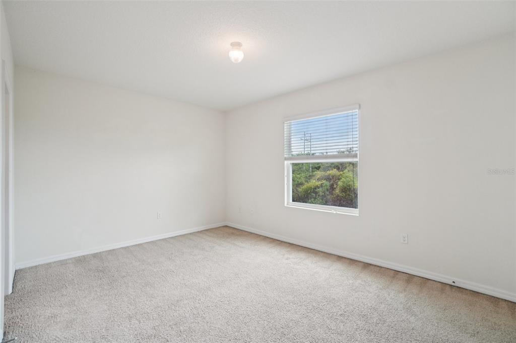 8986 Indigo Trail Loop Riverview, FL 33578 - Photo 35 of 48 an empty room with a window