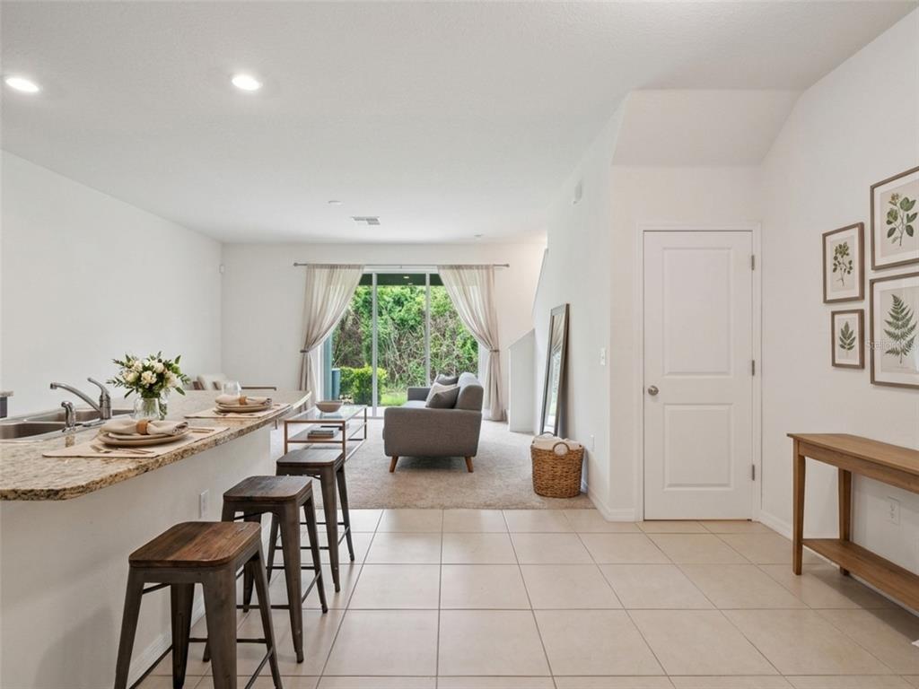 8986 Indigo Trail Loop Riverview, FL 33578 - Photo 4 of 48 a living room with furniture and a window