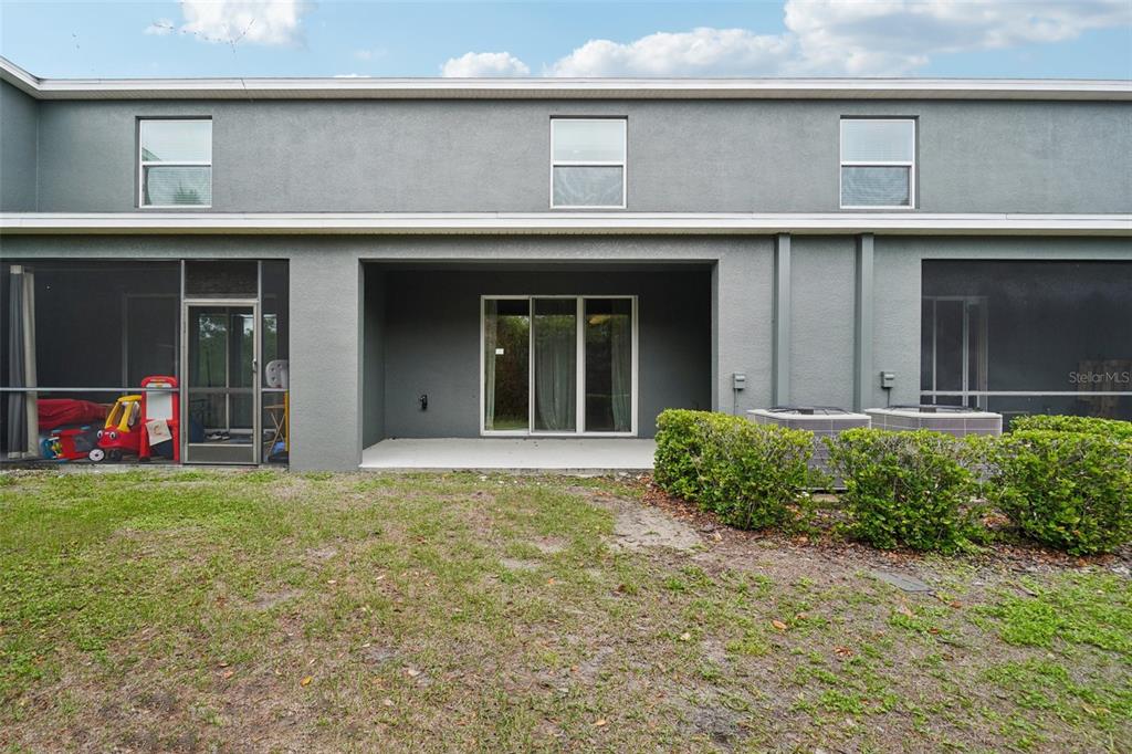 8986 Indigo Trail Loop Riverview, FL 33578 - Photo 45 of 48 a view of a building with a garden