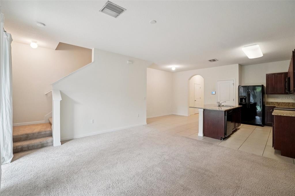 8986 Indigo Trail Loop Riverview, FL 33578 - Photo 8 of 48 a view of kitchen with furniture and a refrigerator