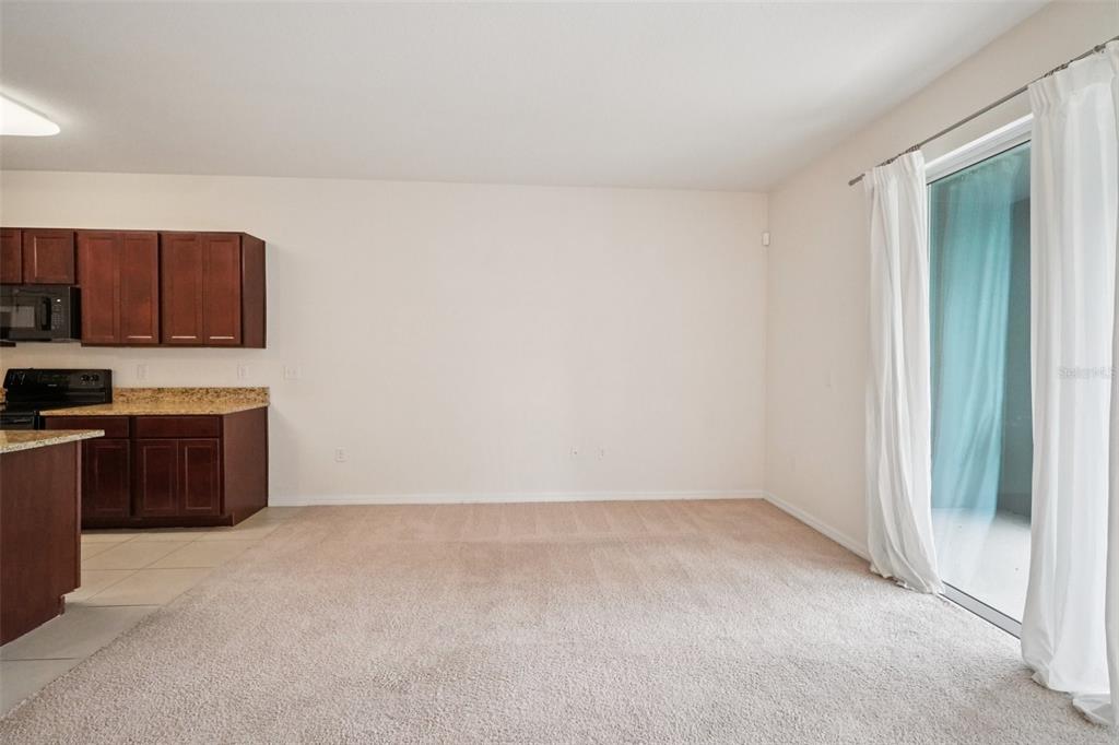 8986 Indigo Trail Loop Riverview, FL 33578 - Photo 10 of 48 a view of kitchen with stainless steel appliances wooden cabinets and a stove top oven