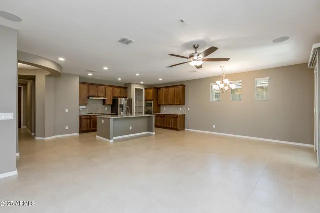 a view of a kitchen with a sink and a chandelier