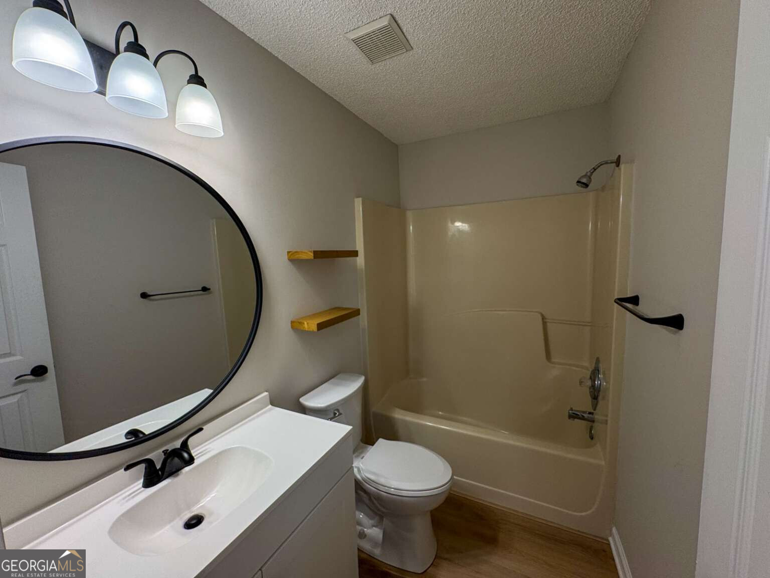110 Talbot Court St. Marys, GA 31558 - Photo 9 of 16 a bathroom with a sink toilet and shower