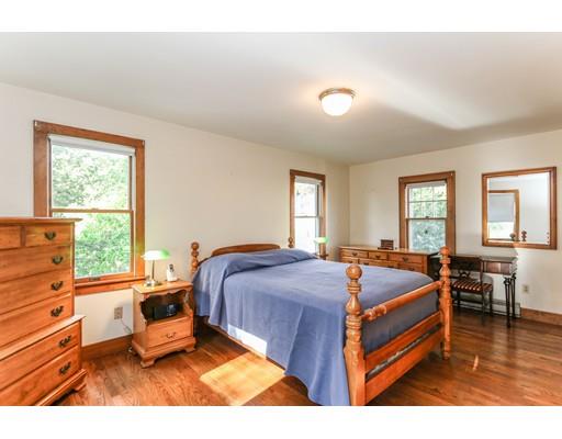 104 Maple Road Longmeadow, MA 01106 - Photo 16 of 28 a bedroom with a bed and wooden floor