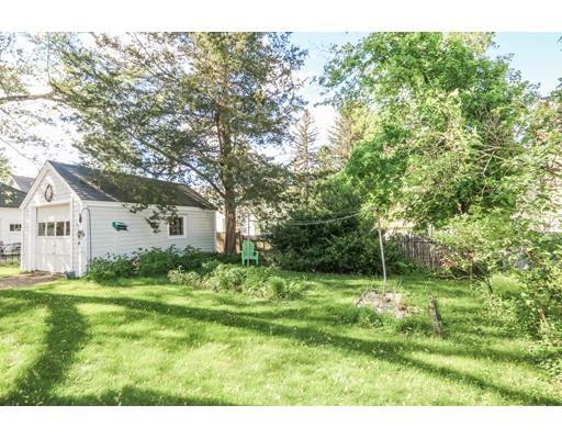 104 Maple Road Longmeadow, MA 01106 - Photo 27 of 28 a backyard of a house with large trees and plants