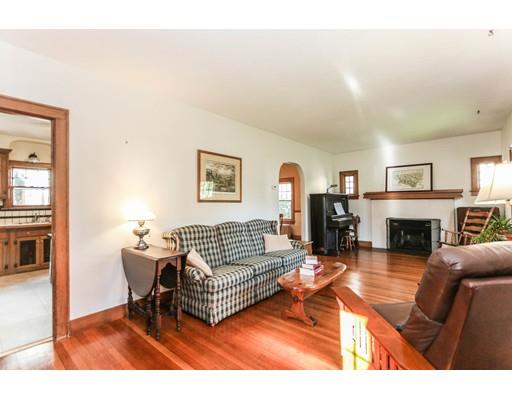 104 Maple Road Longmeadow, MA 01106 - Photo 6 of 28 a living room with furniture a fireplace and a flat screen tv