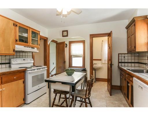 104 Maple Road Longmeadow, MA 01106 - Photo 8 of 28 a kitchen with a table chairs refrigerator and cabinets
