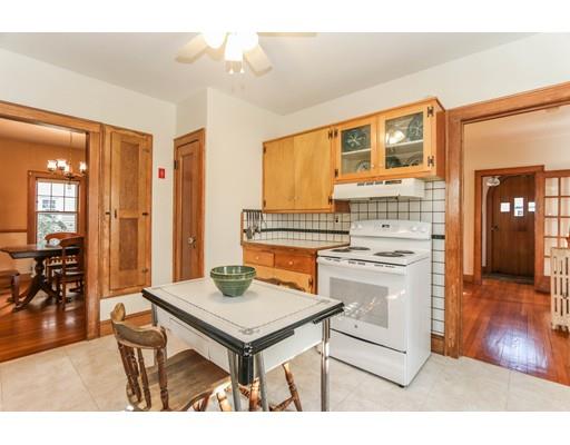 104 Maple Road Longmeadow, MA 01106 - Photo 9 of 28 a kitchen with stainless steel appliances kitchen island granite countertop a table chairs sink and cabinets