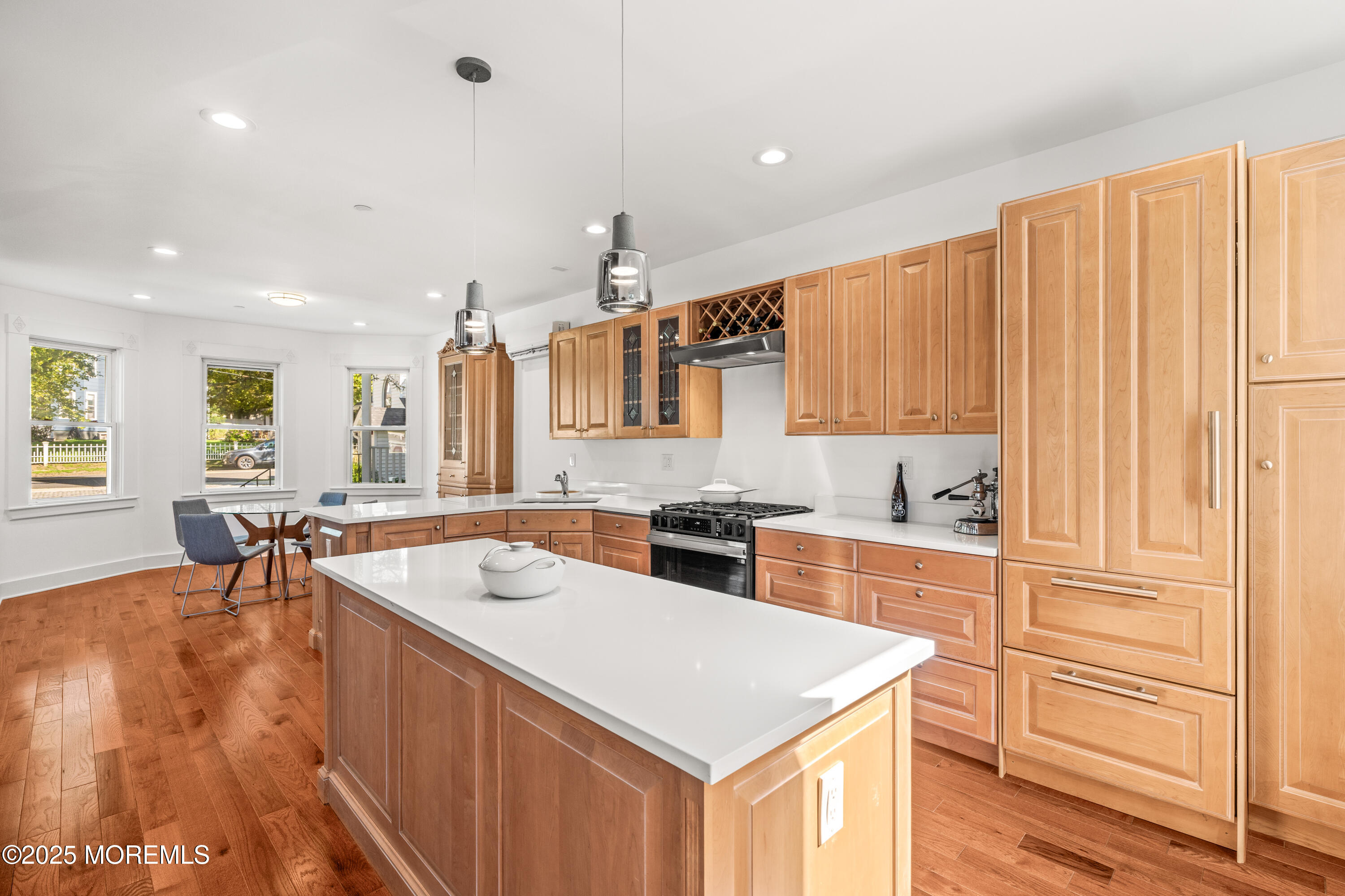 73 3rd Avenue Atlantic Highlands, NJ 07716 - Photo 11 of 57 a kitchen with a sink a stove a refrigerator and cabinets