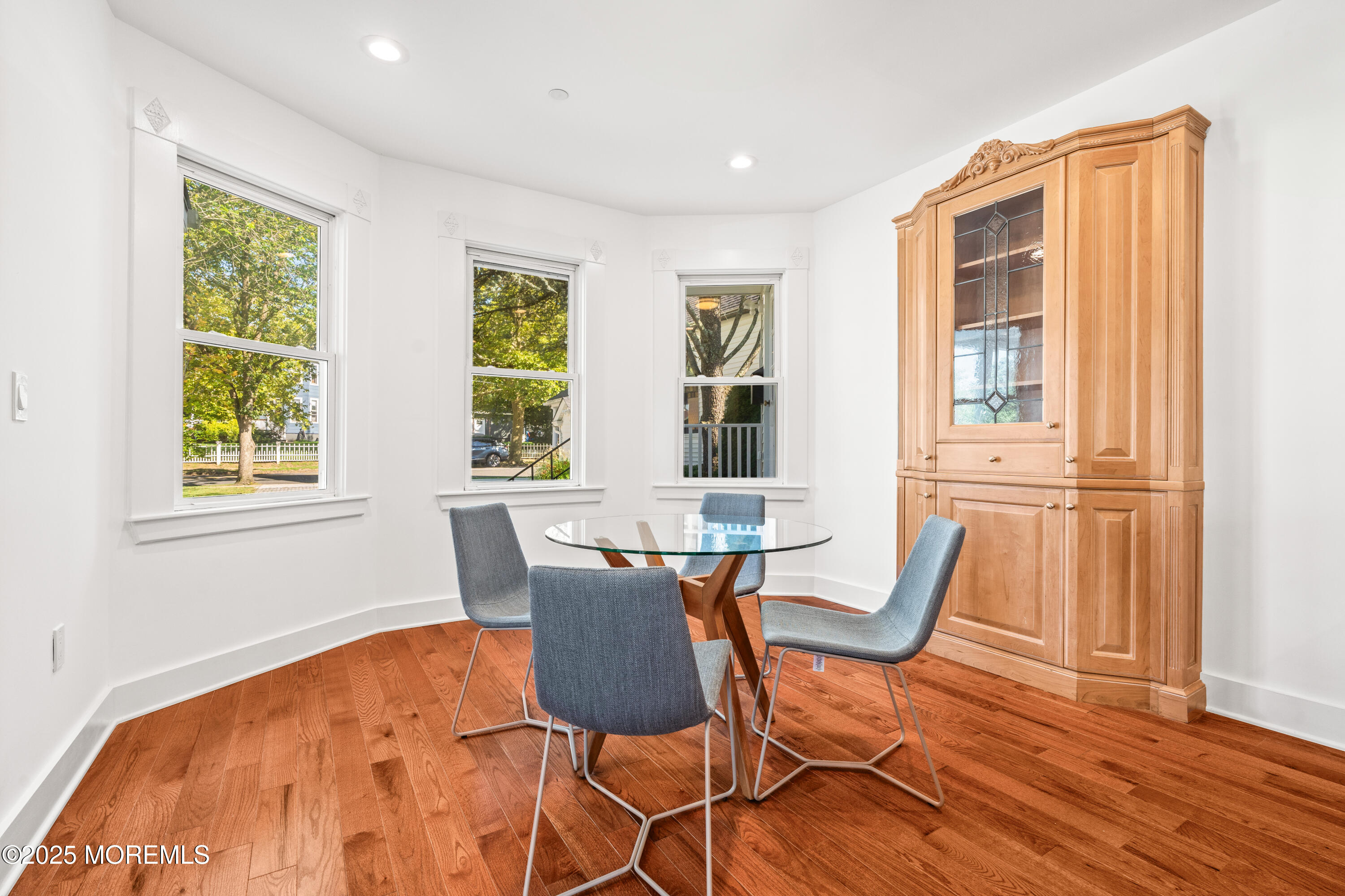 73 3rd Avenue Atlantic Highlands, NJ 07716 - Photo 12 of 57 a view of a dining room with furniture and wooden floor