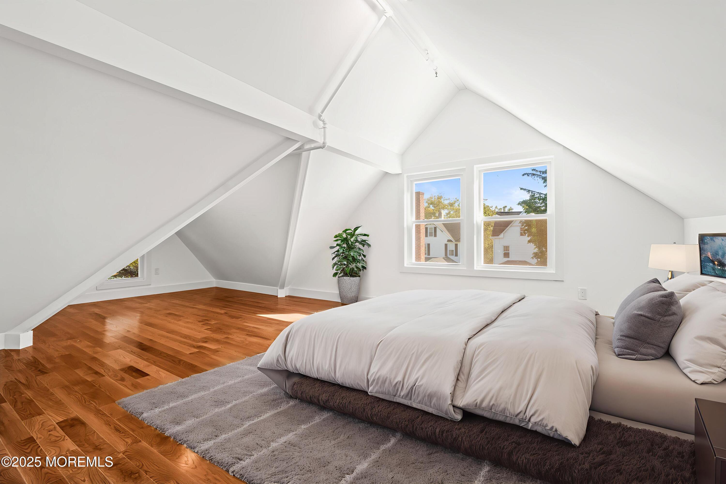 73 3rd Avenue Atlantic Highlands, NJ 07716 - Photo 21 of 57 a bedroom with a large bed and a window