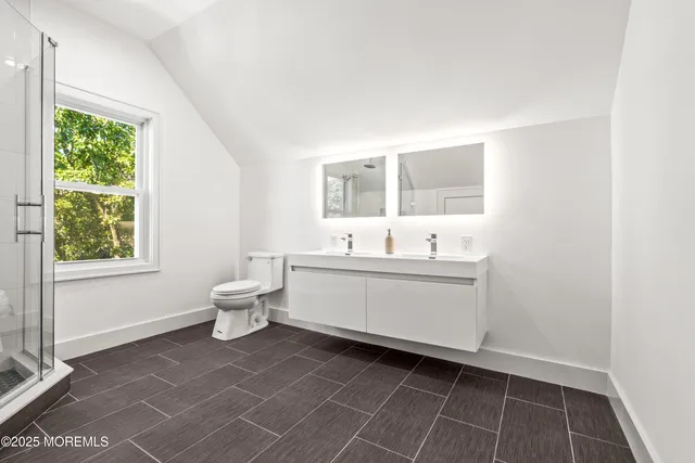 a bathroom with a shower and a toilet