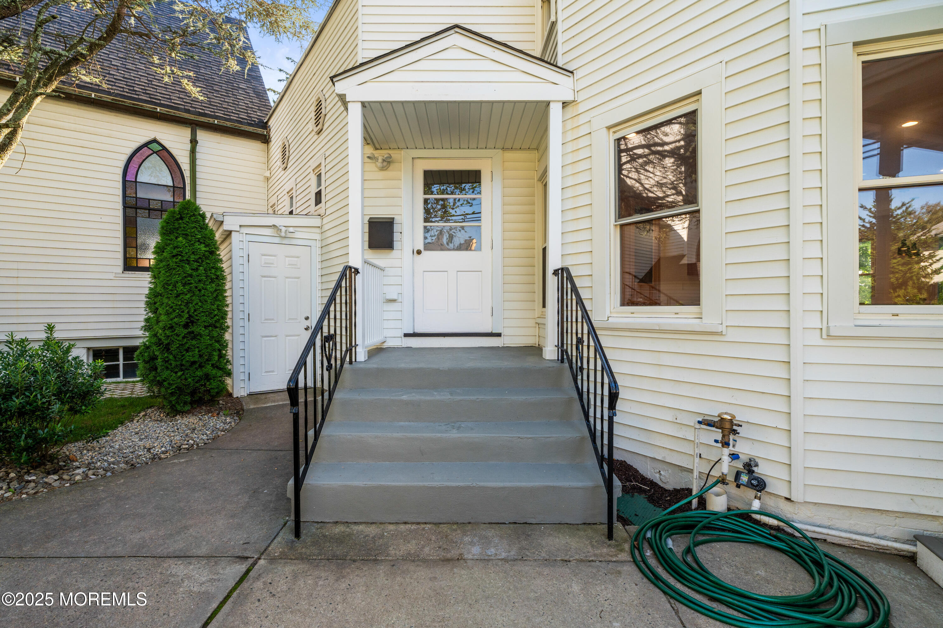 73 3rd Avenue Atlantic Highlands, NJ 07716 - Photo 25 of 57 a view of a house with entryway and wooden fence