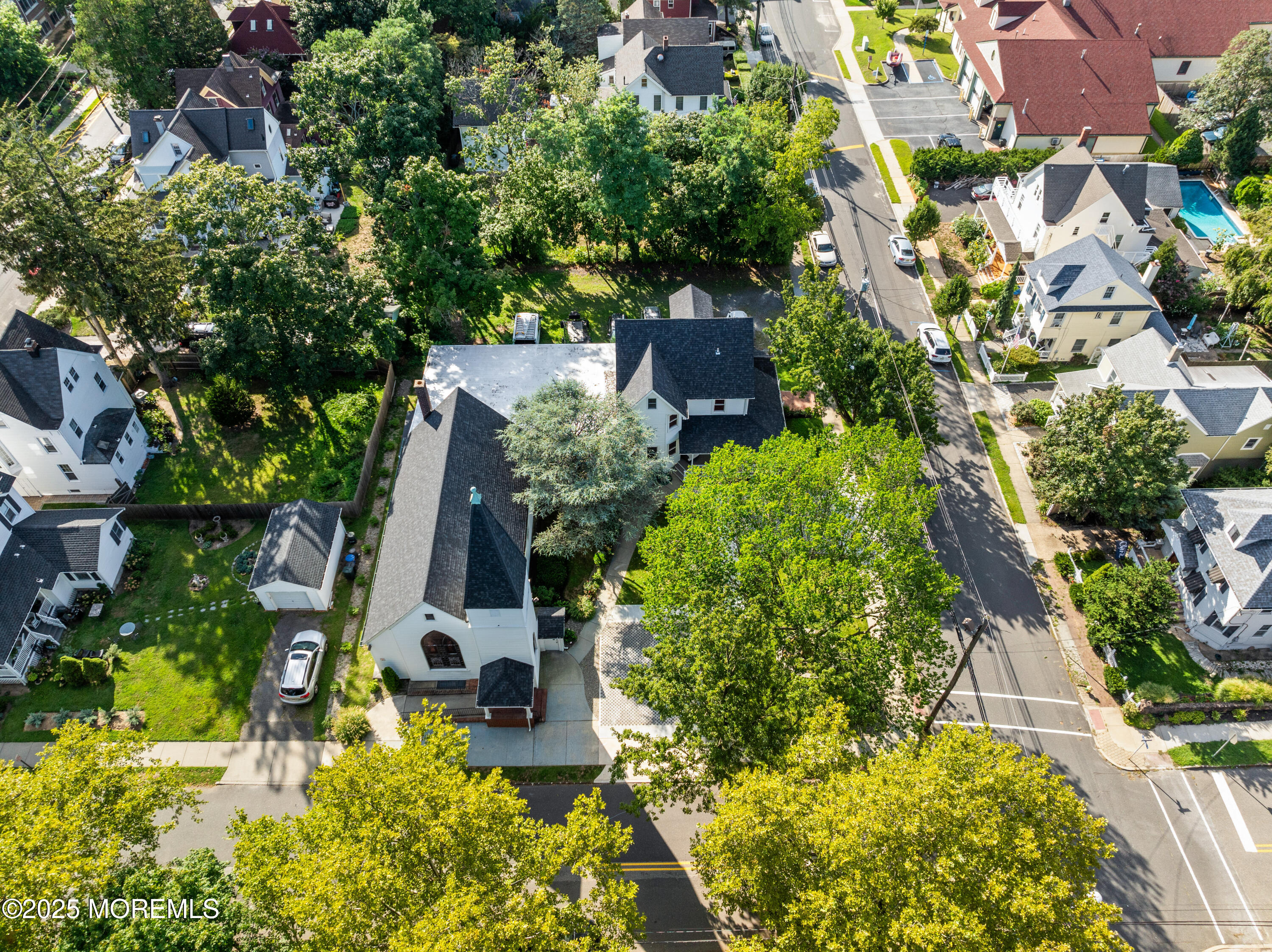 73 3rd Avenue Atlantic Highlands, NJ 07716 - Photo 3 of 57 an aerial view of a house with swimming pool garden and lake view