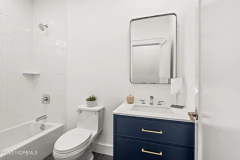 an aerial view of a house with a yard and trees