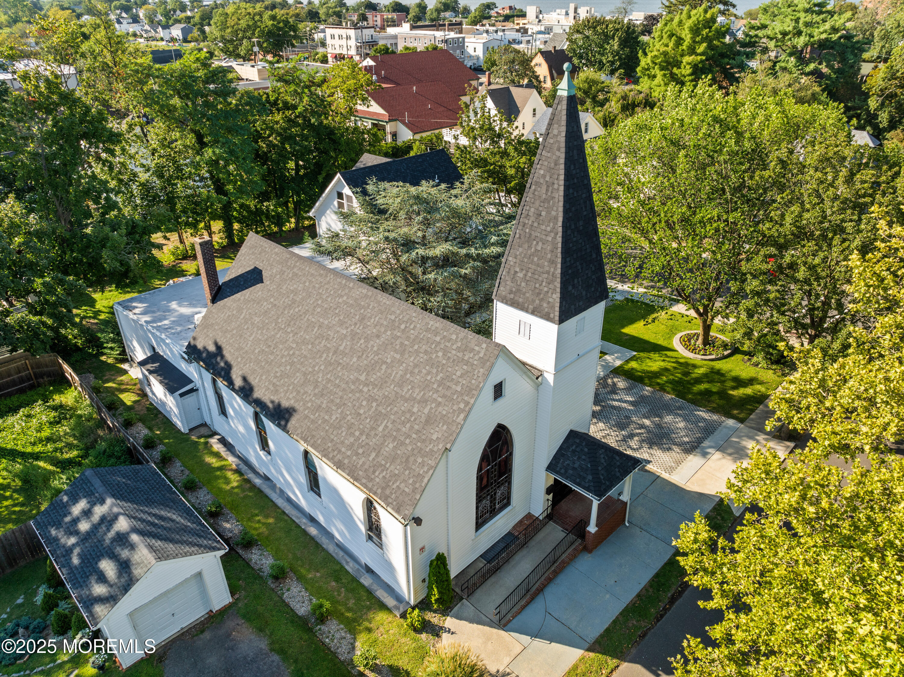 73 3rd Avenue Atlantic Highlands, NJ 07716 - Photo 33 of 57 an aerial view of a house with a yard and trees