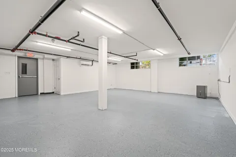 aerial view of a house with a yard and large trees