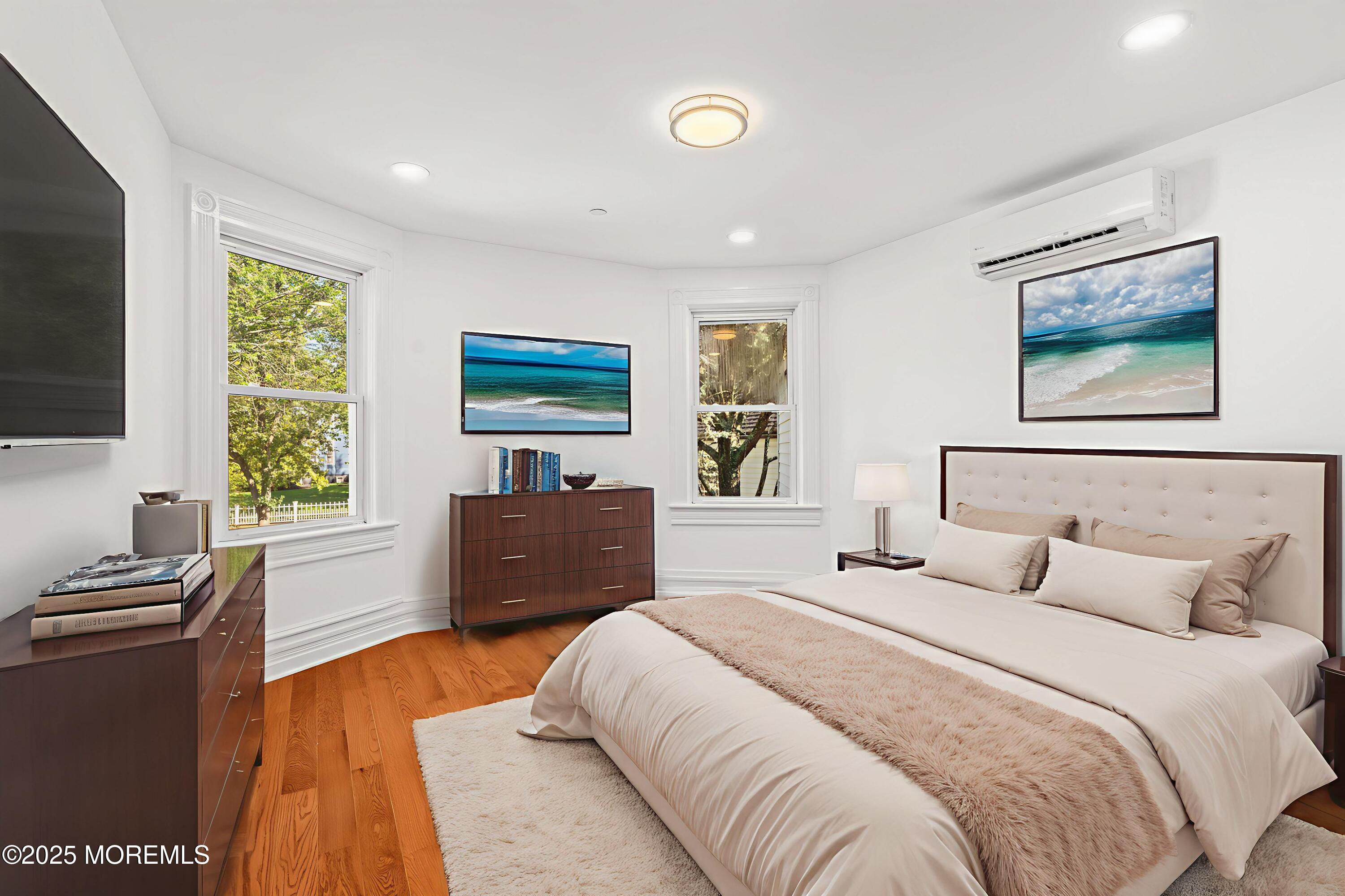 73 3rd Avenue Atlantic Highlands, NJ 07716 - Photo 53 of 57 a bedroom with a bed and a flat screen tv