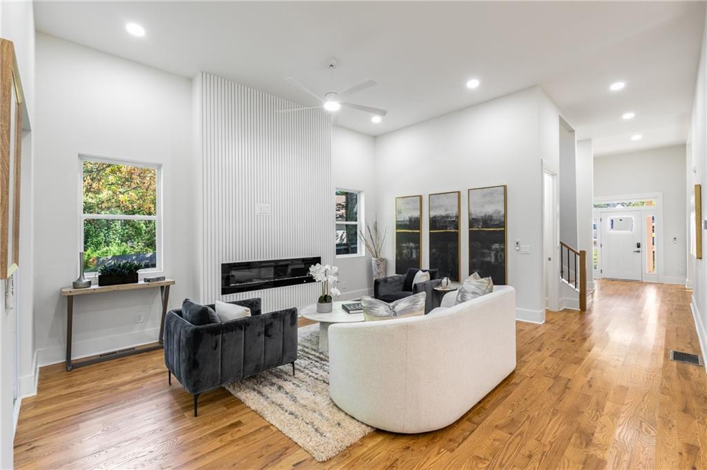 271 Haas Avenue Southeast Atlanta, GA 30316 - Photo 14 of 56 a living room with couches potted plants and a large window