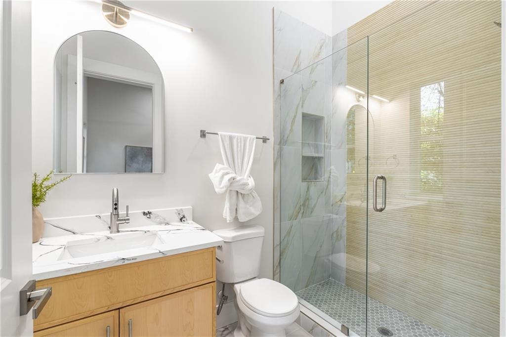 271 Haas Avenue Southeast Atlanta, GA 30316 - Photo 20 of 56 a bathroom with a sink vanity granite toilet and shower