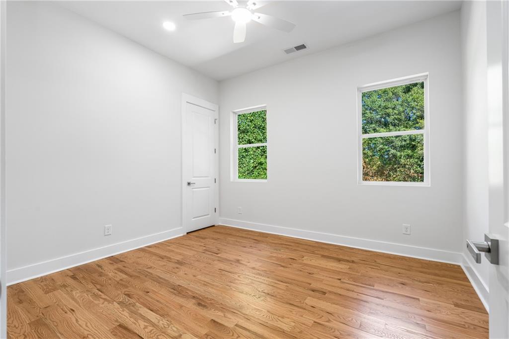 271 Haas Avenue Southeast Atlanta, GA 30316 - Photo 23 of 56 wooden floor in an empty room with a window