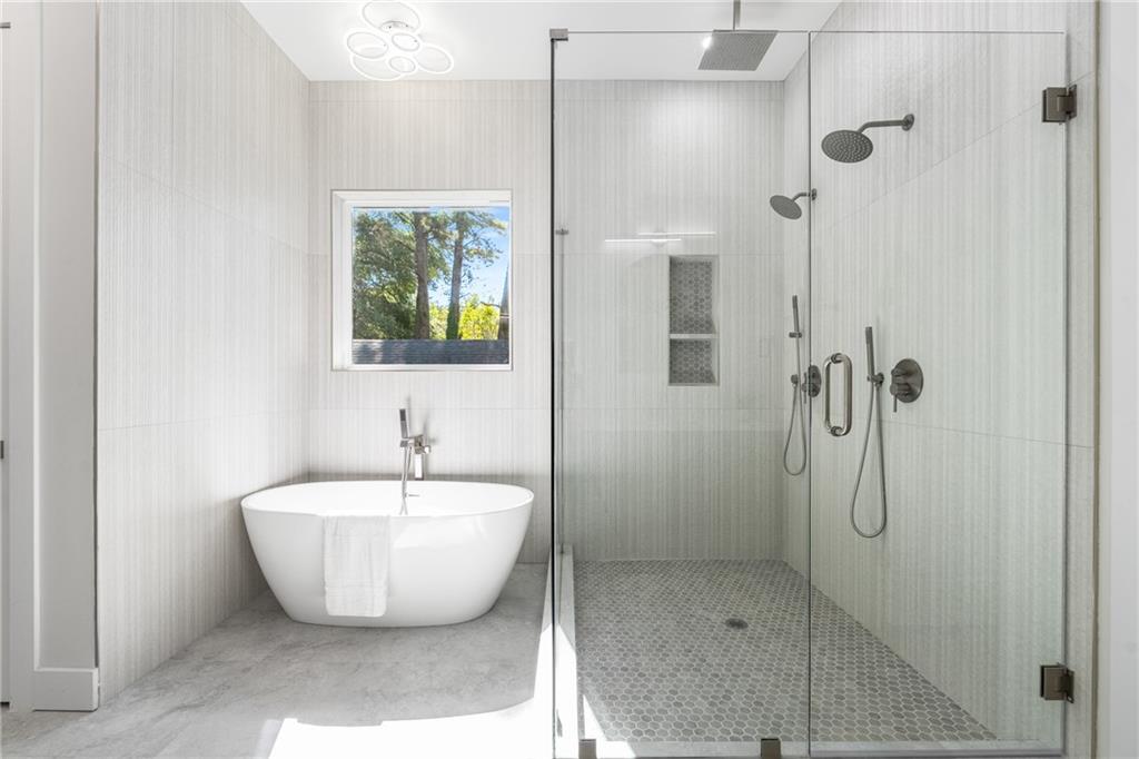 271 Haas Avenue Southeast Atlanta, GA 30316 - Photo 36 of 56 a bathroom with a bathtub and shower