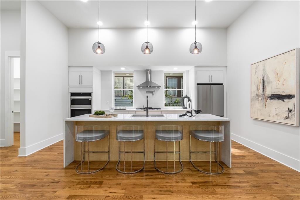 271 Haas Avenue Southeast Atlanta, GA 30316 - Photo 8 of 56 a kitchen with stainless steel appliances granite countertop a sink and a refrigerator