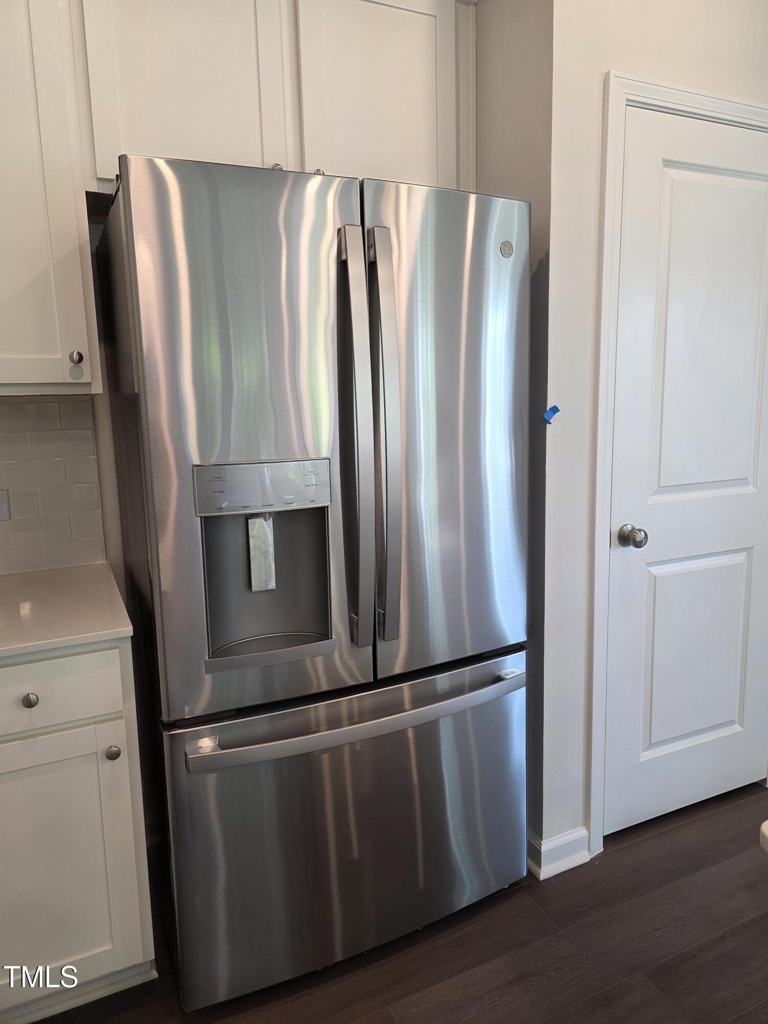 176 Paramount Drive Smithfield, NC 27577 - Photo 5 of 22 an empty room with wooden floor and fan