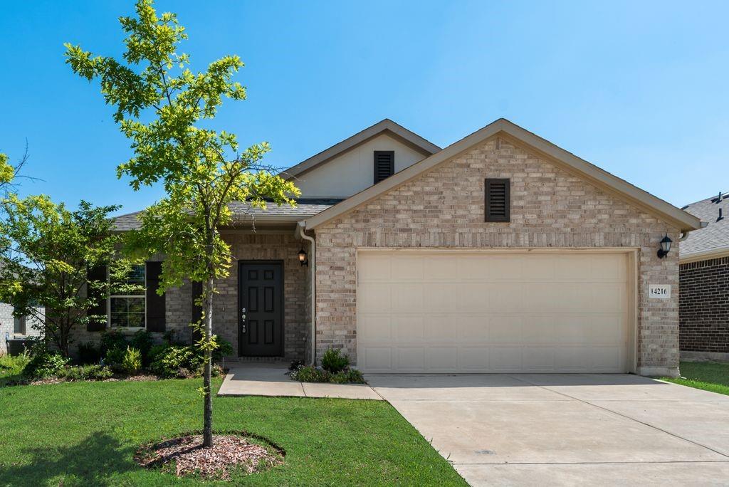 14216 Aberavon Drive Pilot Point, TX 76258 - Photo 2 of 19 Brick exterior with contrasting dark window shutters
