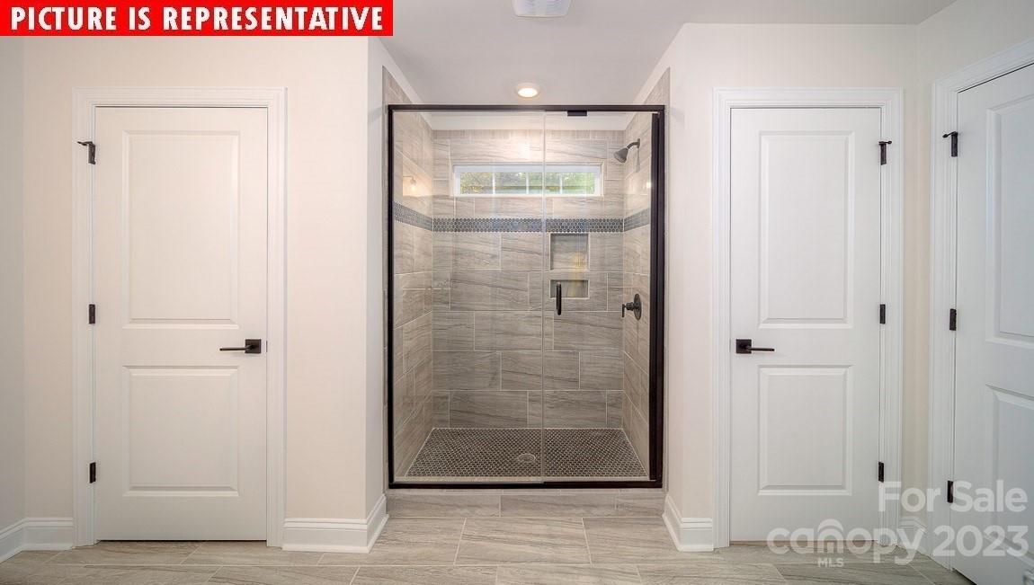 309 Streamwood Road Troutman, NC 28166 - Photo 15 of 47 a bathroom with a shower